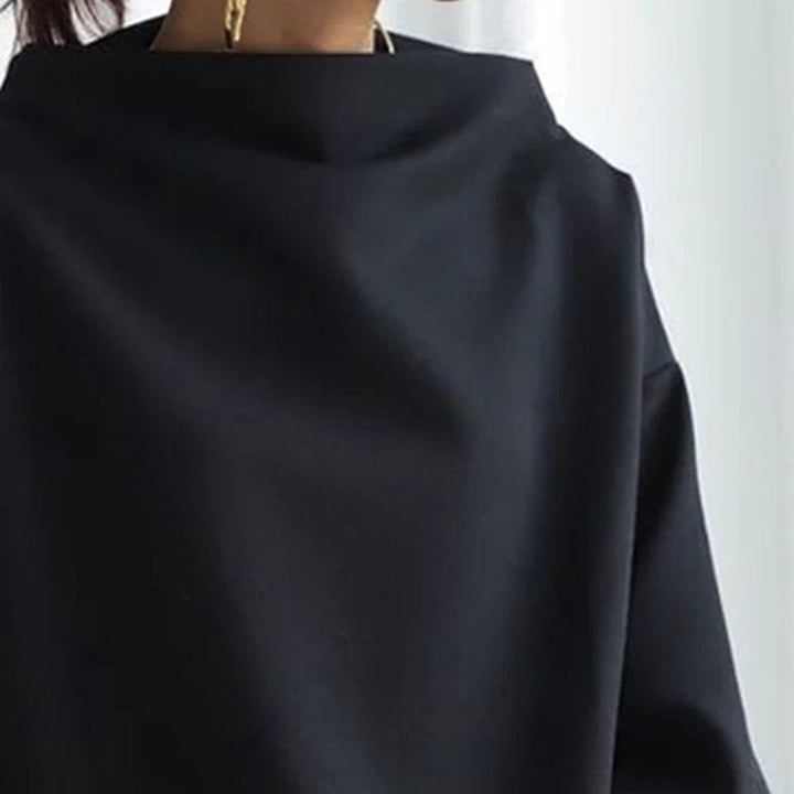 Blusa de mujer manga larga, cuello caja. Prenda básica cómoda y holgada para un estilo casual relajado.