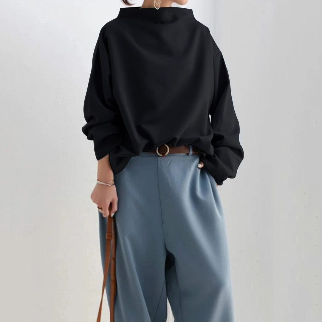 Prenda básica: blusa mujer cuello caja, manga larga. Diseño holgado para máxima comodidad y estilo casual.