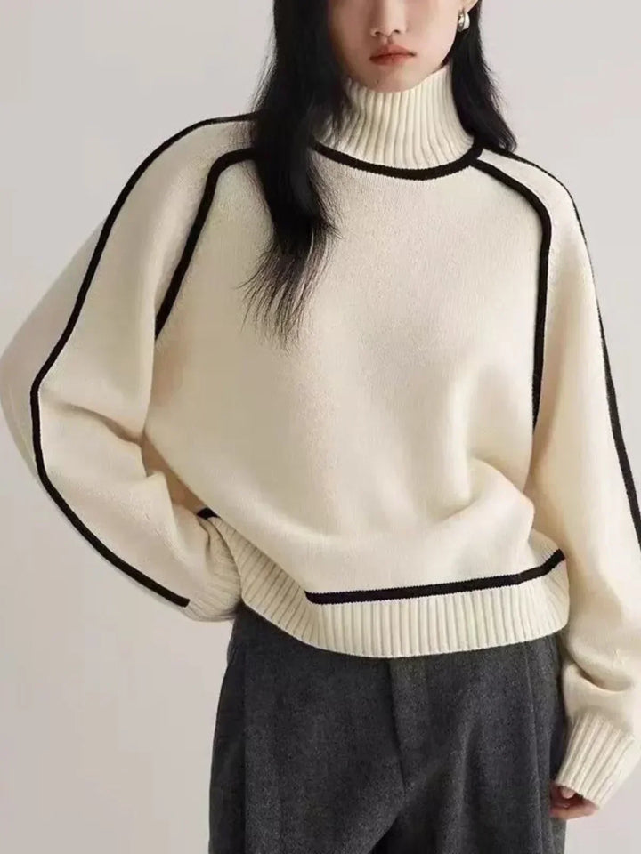 Jersey de cuello alto para mujer con elegante detalle de cinturón. Tejido de punto, abrigador para el frío.