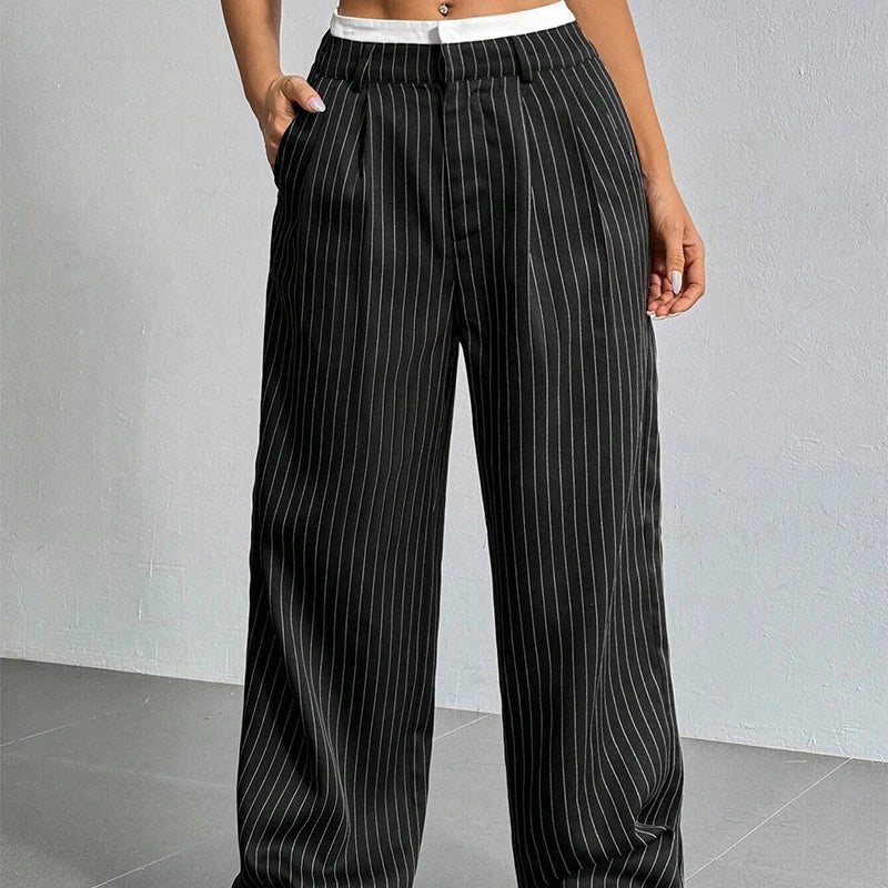 Pantalones de mujer de corte holgado, pierna ancha y cintura alta. Confort y elegancia para cualquier ocasión.