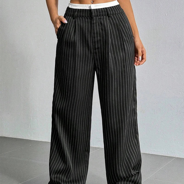 Pantalones de mujer de corte holgado, pierna ancha y cintura alta. Confort y elegancia para cualquier ocasión.
