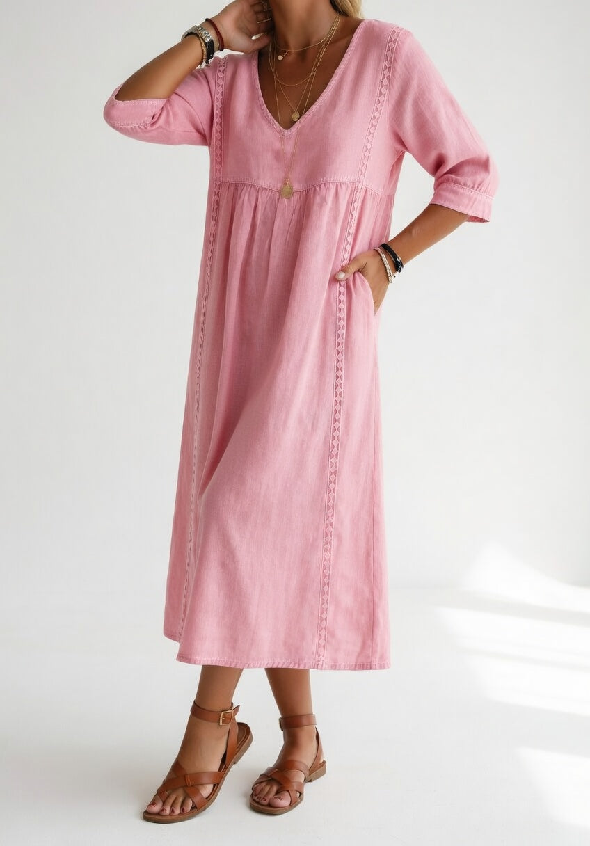 Vestido midi de mujer, silueta fluida y relajada, mangas tres cuartos y cuello V para confort.