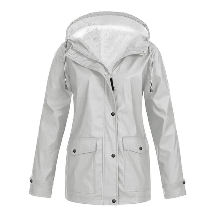 Detalle de tejido en abrigo impermeable mujer, corte medio. Chaqueta cálida y elegante para lluvia.