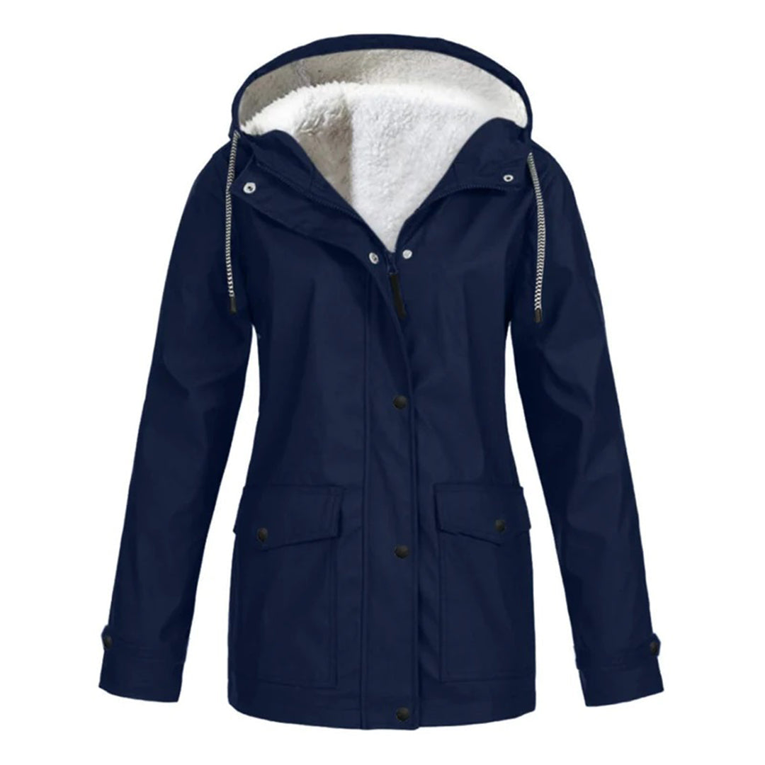 Abrigo mujer elegante e impermeable de media longitud. Ropa exterior chic para otoño e invierno.