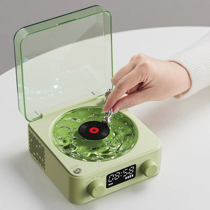 Disfruta de música y ambiente con este altavoz Bluetooth retro con proyección y sonidos naturales.