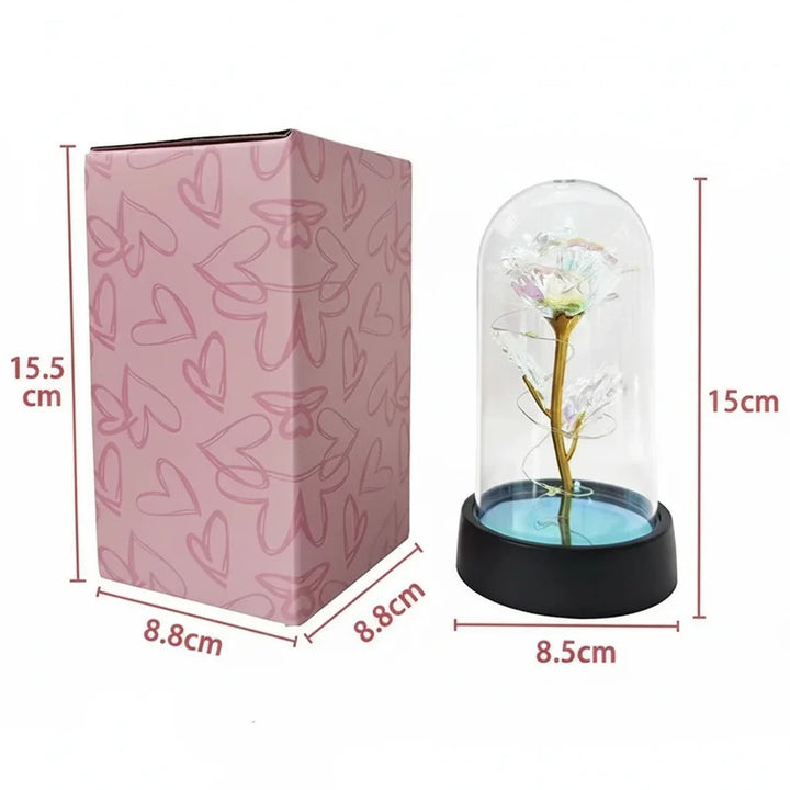 Preciosa lámpara LED rosa en cúpula de cristal, ideal para ambiente romántico, decoración o regalo especial.