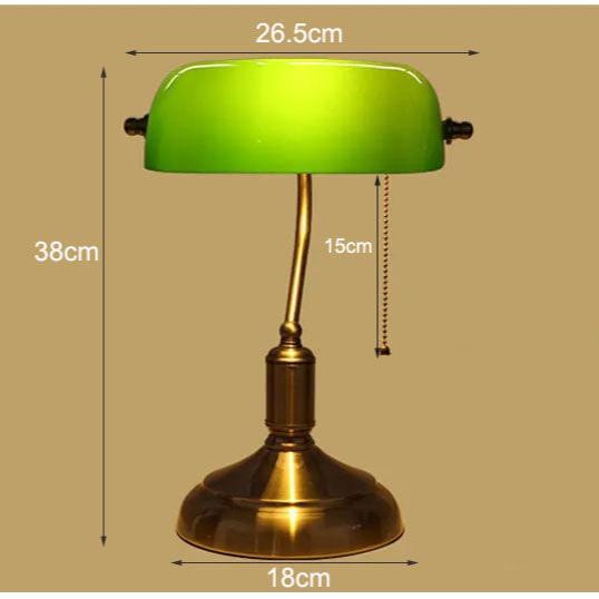 Lámpara de mesa estilo vintage en bronce. Complemento ideal para escritorios y zonas de lectura.