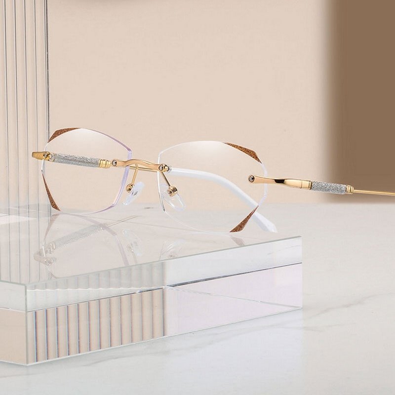 Gafas oftálmicas sin montura para mujer en plata. Lentes progresivas bloquean luz azul para lectura cómoda.