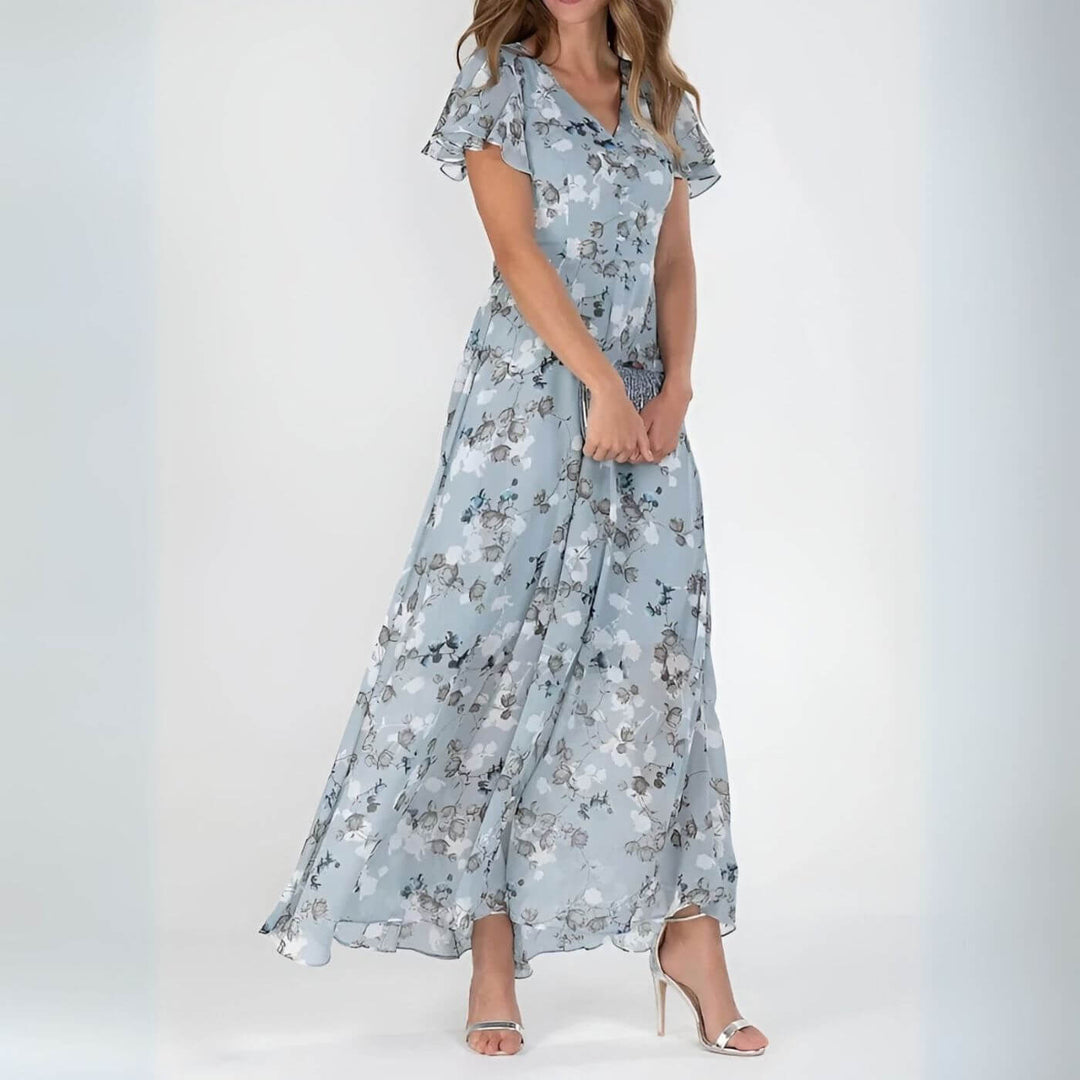 Vestido floral maxi de mujer elegante para fiesta o eventos de verano. Diseño fluido con escote V y estampado vibrante.