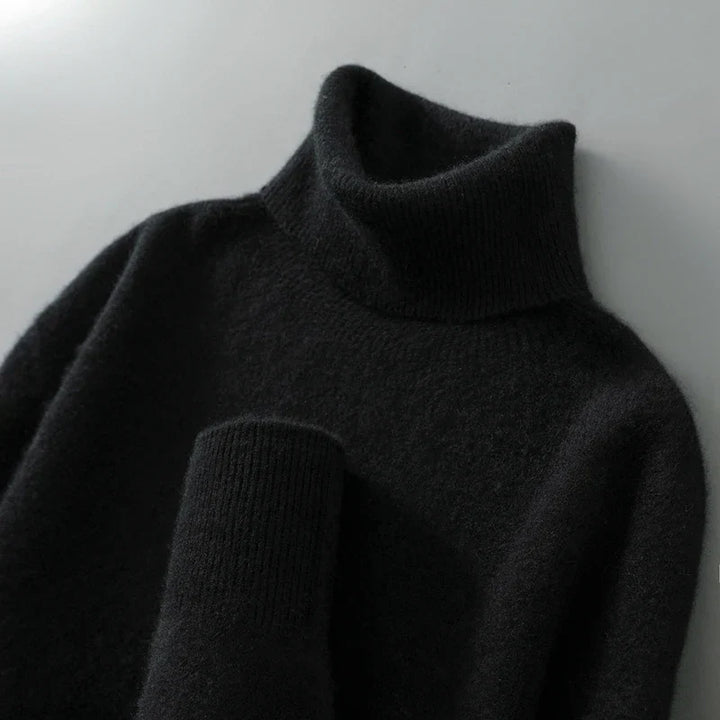 Jersey de mujer de lana con cuello alto y ajuste relaxed fit, cómodo y moderno para el día a día.