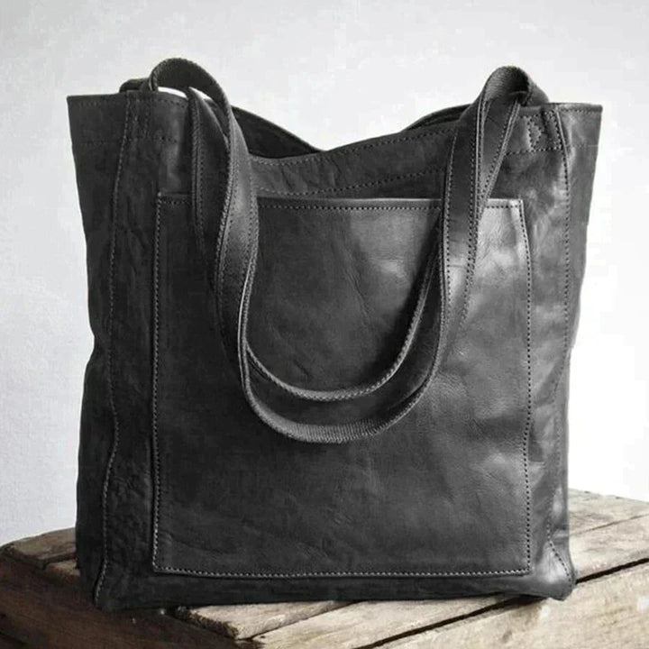 Bolso tote grande negro para mujer, diseño moderno y gran capacidad.