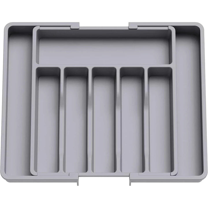 Solución de almacenaje: organizador expandible para utensilios en cajones de cocina moderna, mantiene el orden.