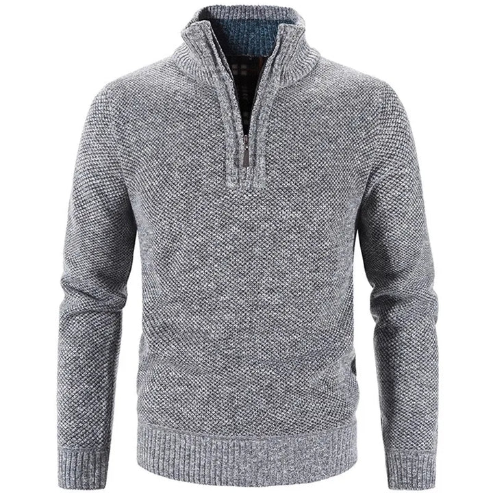 Jersey de hombre gris oscuro con media cremallera. Prenda cómoda y cálida, esencial para invierno y otoño.