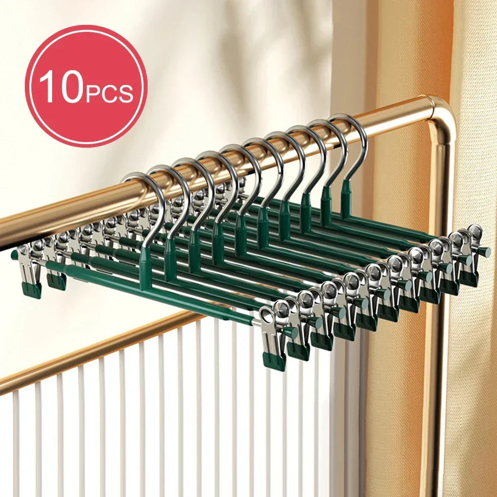Percha de acero inoxidable con clips ajustables para faldas y pantalones. Maximiza el espacio y orden en tu armario.