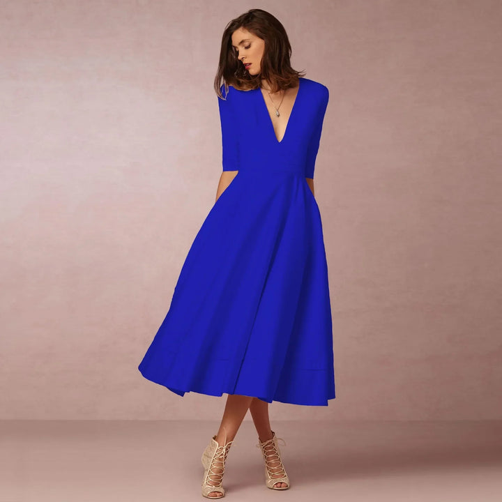 Vestido midi que realza la figura, mujer. Escote V y mangas codo. Elegante para fiesta o casual.