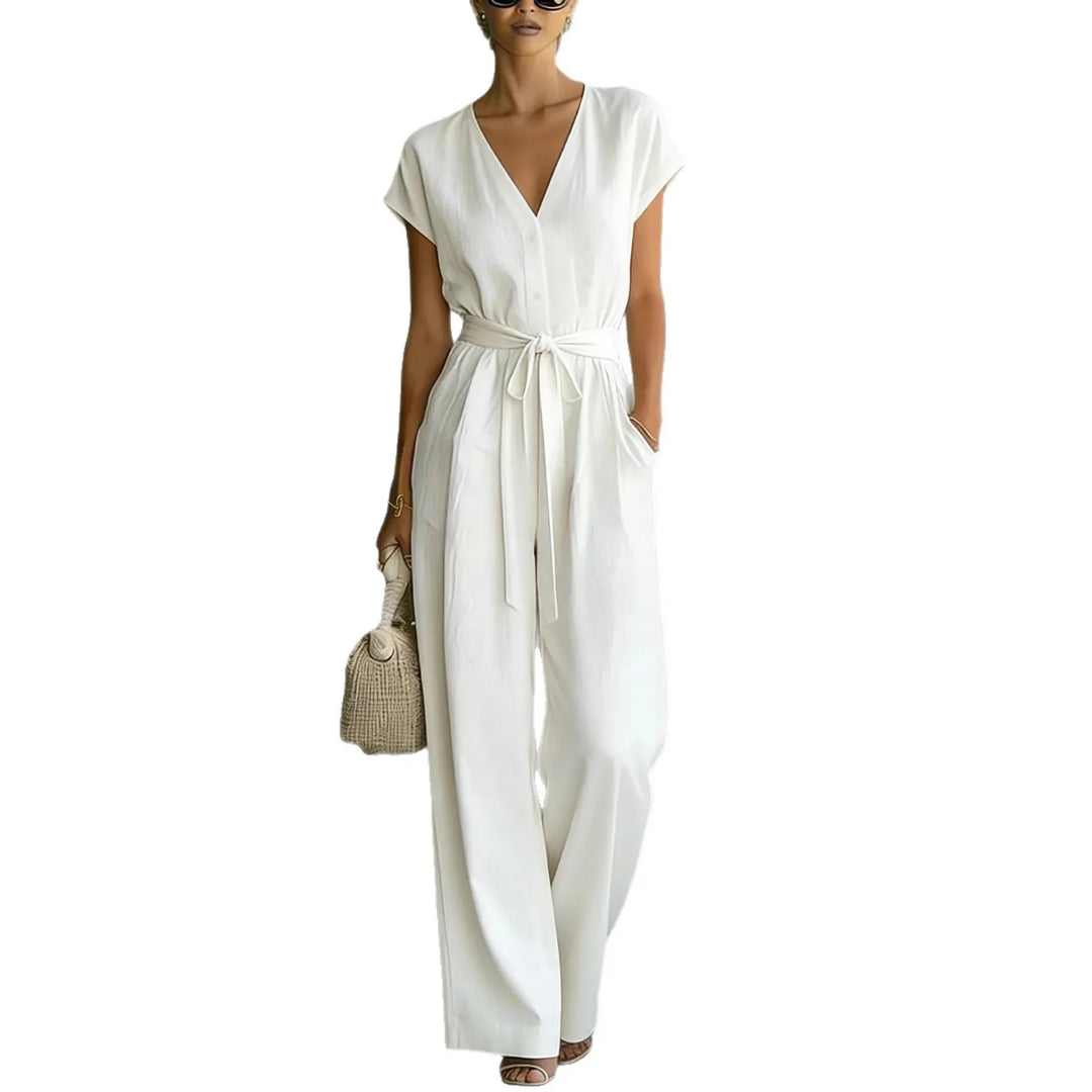 Mono femenino elegante, escote V y pantalón ancho con cinturón. Moda de oficina o casual para primavera-verano.