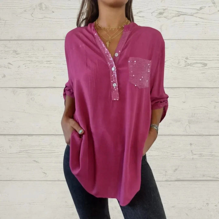 Blusa casual de mujer con lentejuelas brillantes y botones frontales. Moda femenina y versátil.