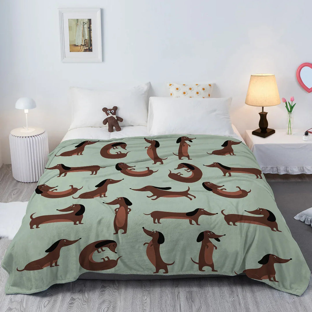 Manta de franela suave y cálida con diseño de perro teckel, perfecta para decoración del hogar y mascotas en el sofá.