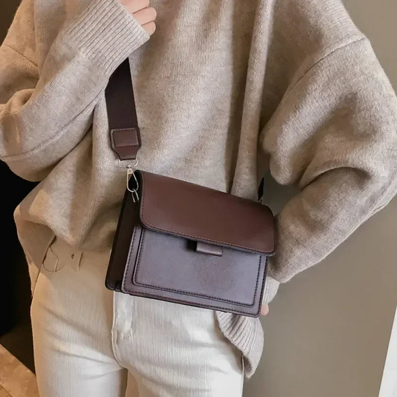 Bolso estructurado moderno para mujer, color negro. Elegante accesorio de hombro para moda femenina y organización diaria.