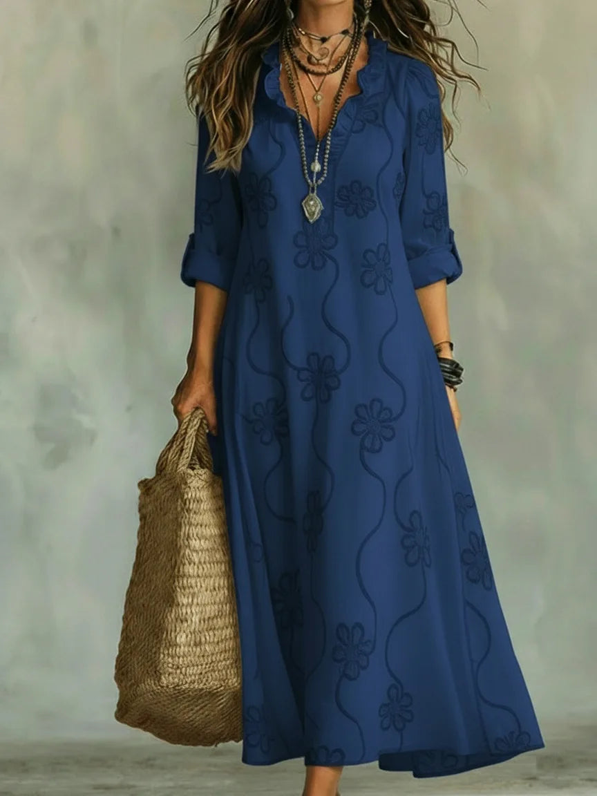 Vestido bohemio largo de mujer, con detallado bordado floral y mangas enrollables, ideal para vacaciones.