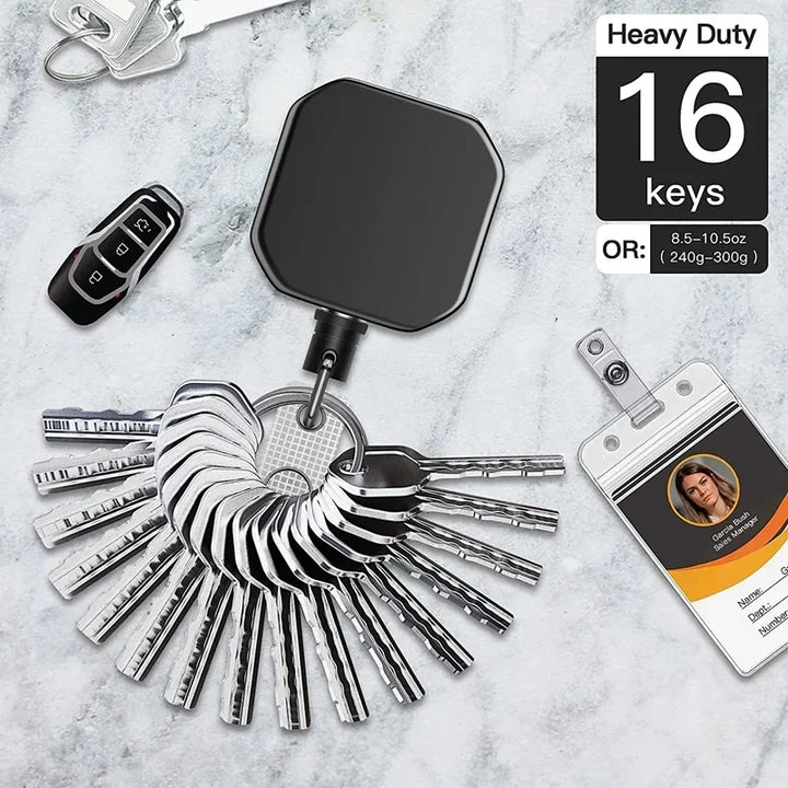 Llavero de seguridad metálico con cable de acero extensible, perfecto para identificación y organización de llaves.
