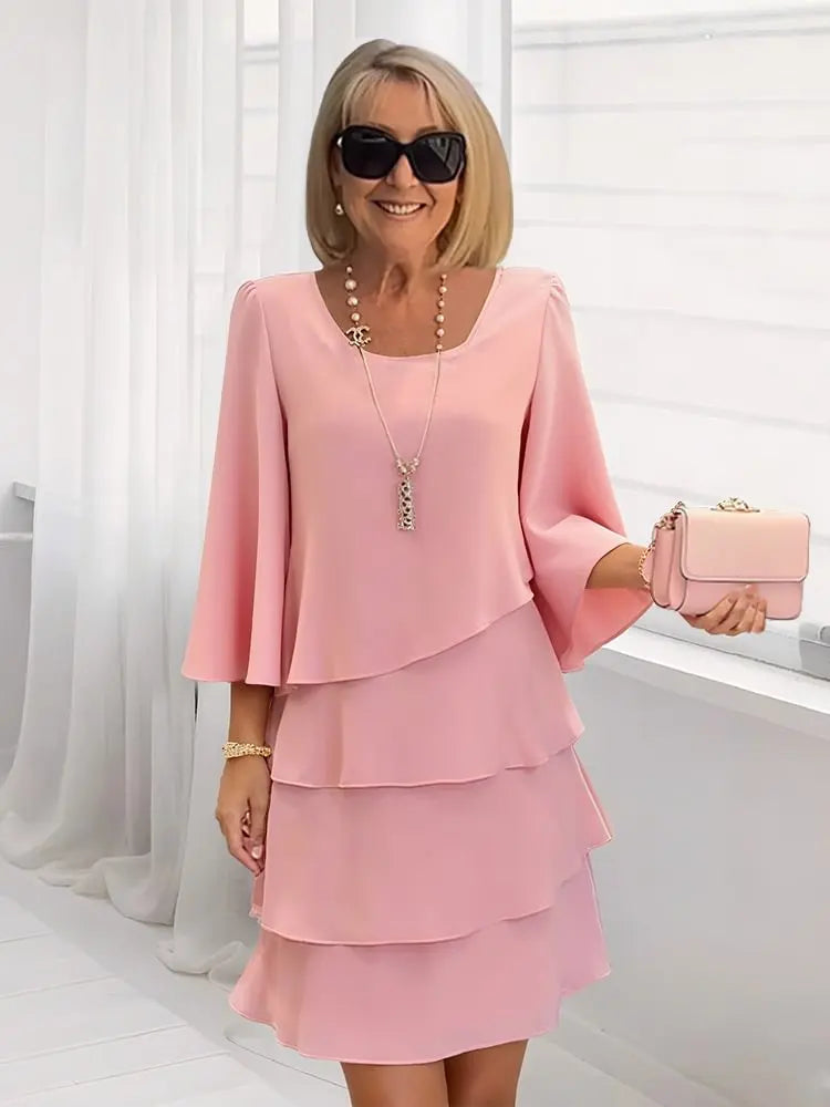 Vestido fluido elegante para mujer con volantes, ideal para primavera y verano. Comodidad y estilo casual.