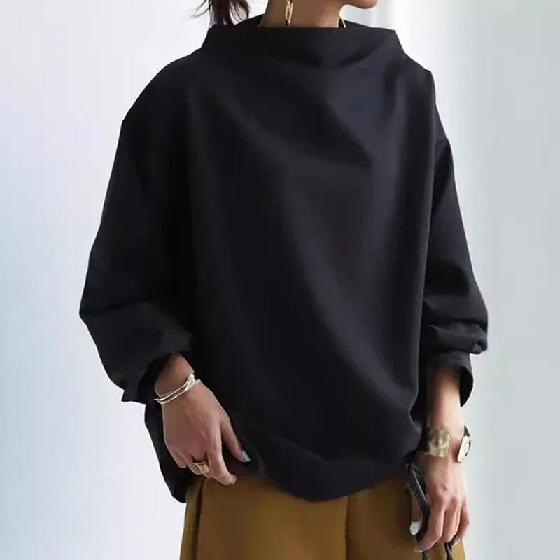 Jersey de punto grueso para mujer, corte holgado y cuello alto. Perfecto para el frío invernal y el confort.