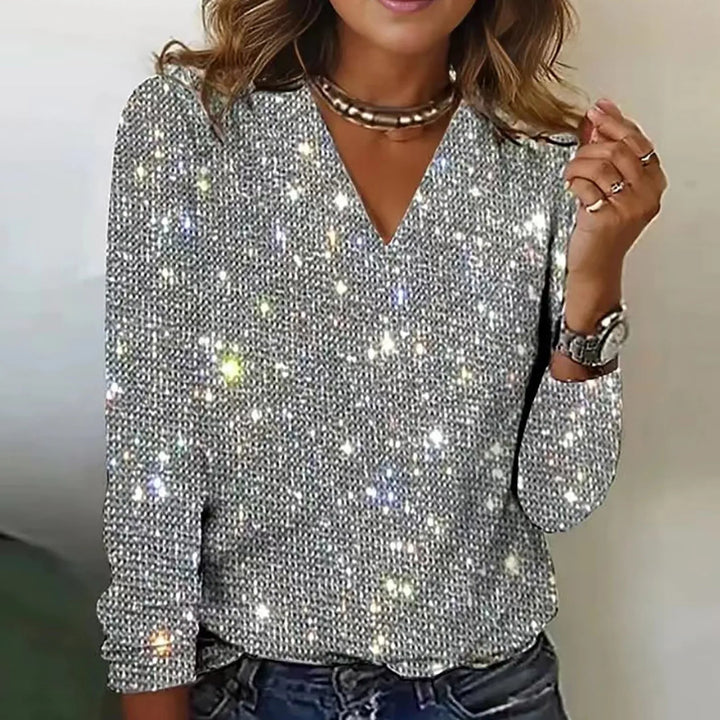 Top ROWELIA mujer brillante, ideal para fiesta o noche. Elegancia sofisticada y moda femenina.