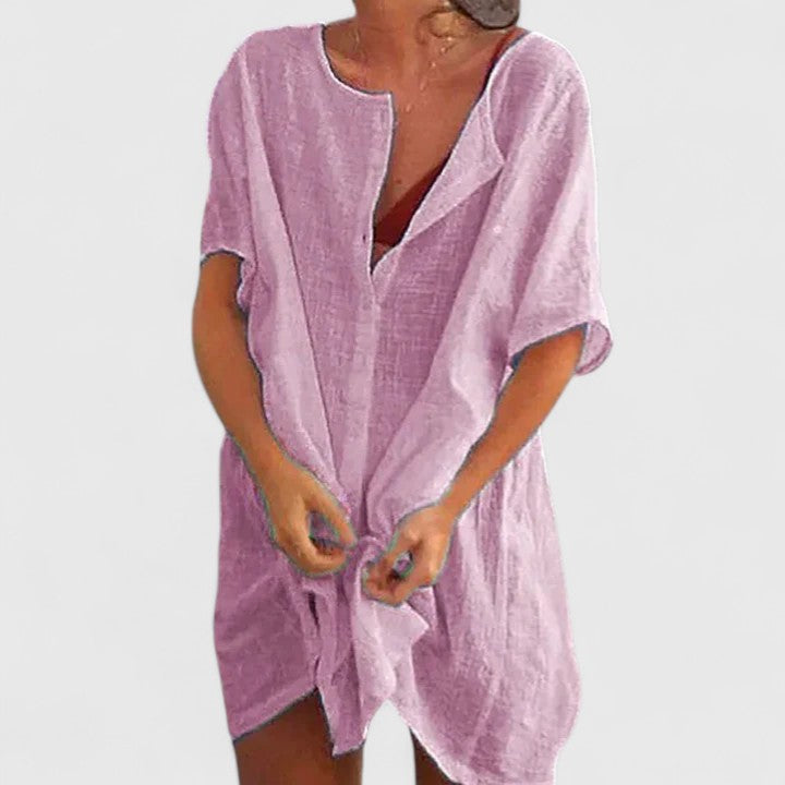 Vestido túnica de mujer con escote V y corte suelto. Estilo casual elegante para verano y playa.