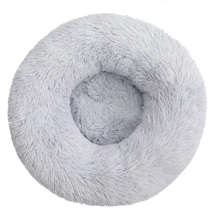 Cama redonda de peluche suave, lavable y lujosa para mascotas, garantizando el mejor descanso para perros y gatos.