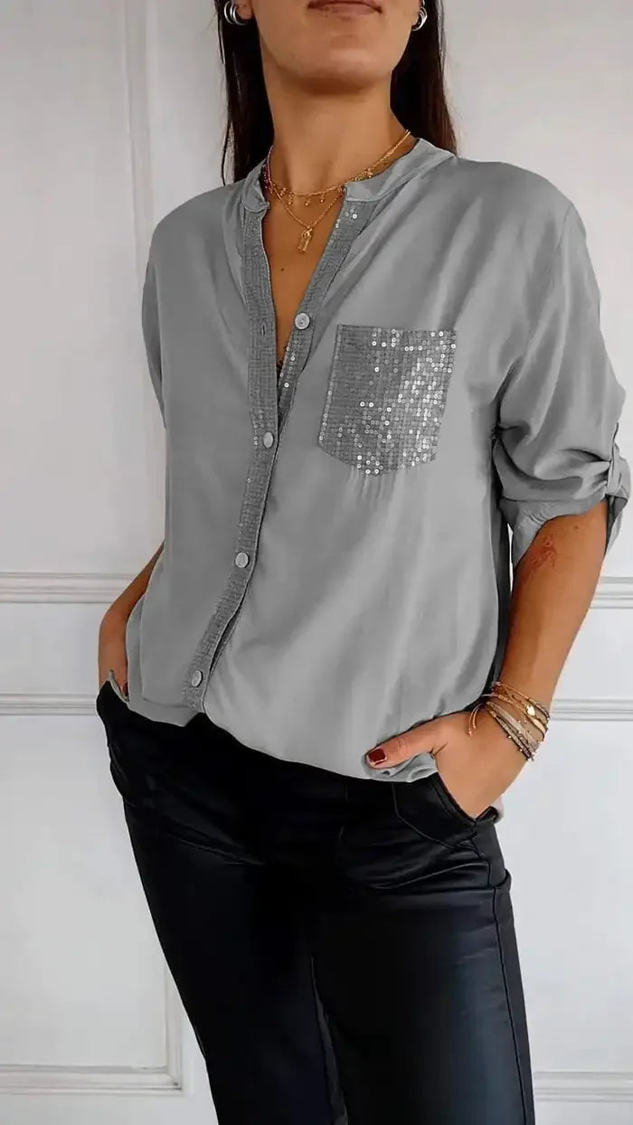 Blusa de mujer casual con lentejuelas y botones, ideal para un estilo moderno de primavera.