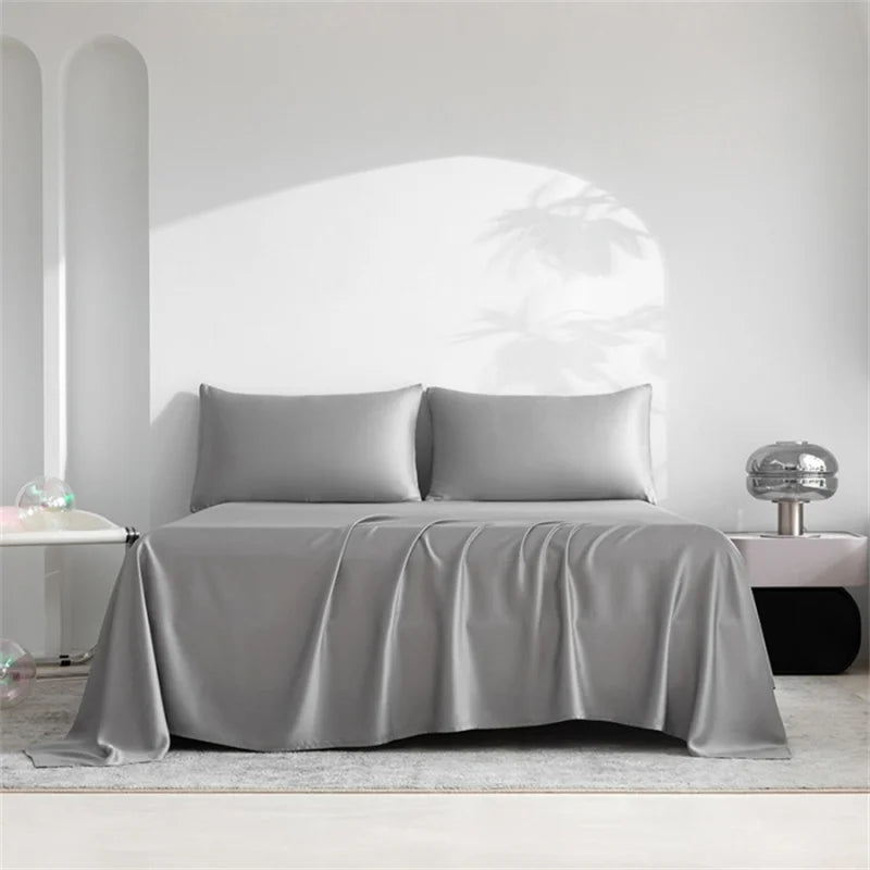 Sábanas de lujo dobladas, listas para añadir confort y suavidad a cualquier cama de hogar.