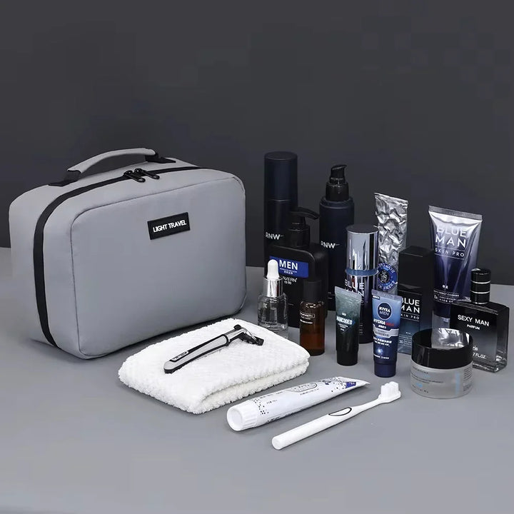 Neceser de viaje abierto mostrando compartimentos, organizador de aseo impermeable para accesorios de viaje.