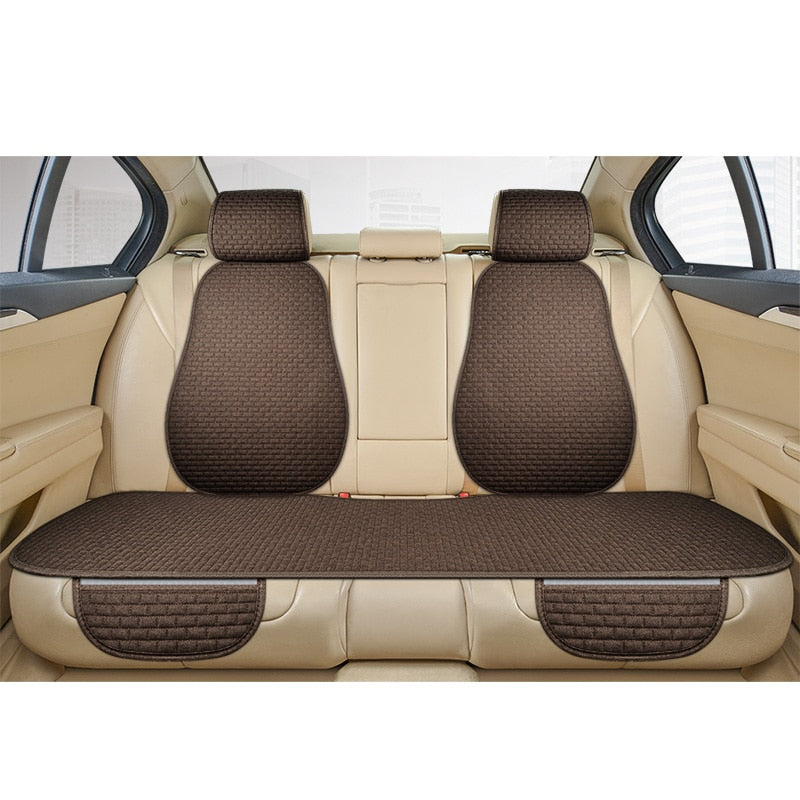 Detalle de la textura de lino en funda de asiento de coche universal antideslizante.