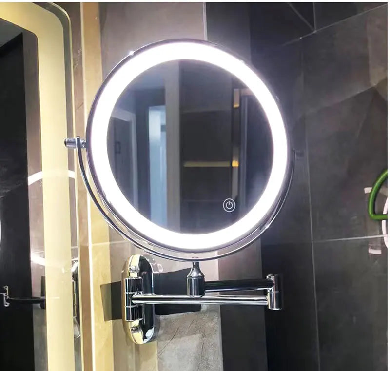 Espejo cosmético negro con aumento e iluminación LED, ideal para precisión en maquillaje y afeitado.