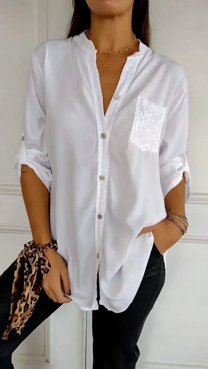Blusa femenina con botones y lentejuelas, para un look brillante y casual. Estilo elegante.