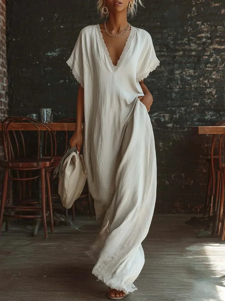 Vestido largo de mujer con sofisticado encaje y escote V. Estilo veraniego elegante y fluido para fiestas.