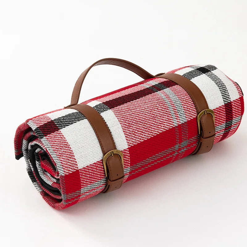 Manta de picnic impermeable portátil con correa de cuero, perfecta para exteriores y viajes familiares.