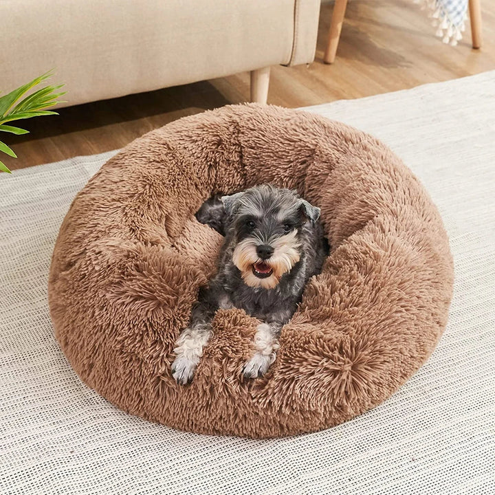 Lujosa cama de peluche redonda para mascotas, muy suave y lavable, perfecta para el descanso de perros y gatos.