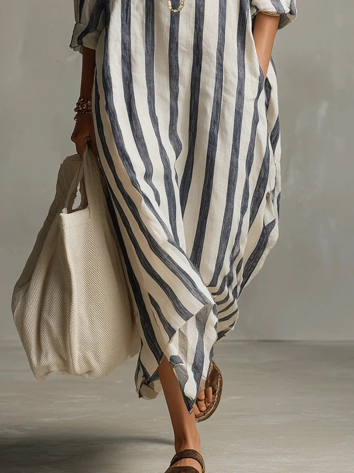Moda mujer: Vestido camisero largo rayado, de corte fluido, elegante y moderno para cualquier ocasión.