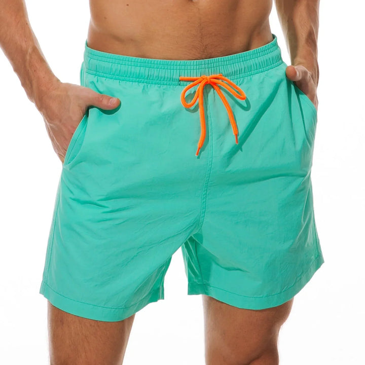Short de baño liso y ligero para hombre. Confortable, con bolsillo de cremallera; perfecto para el verano.