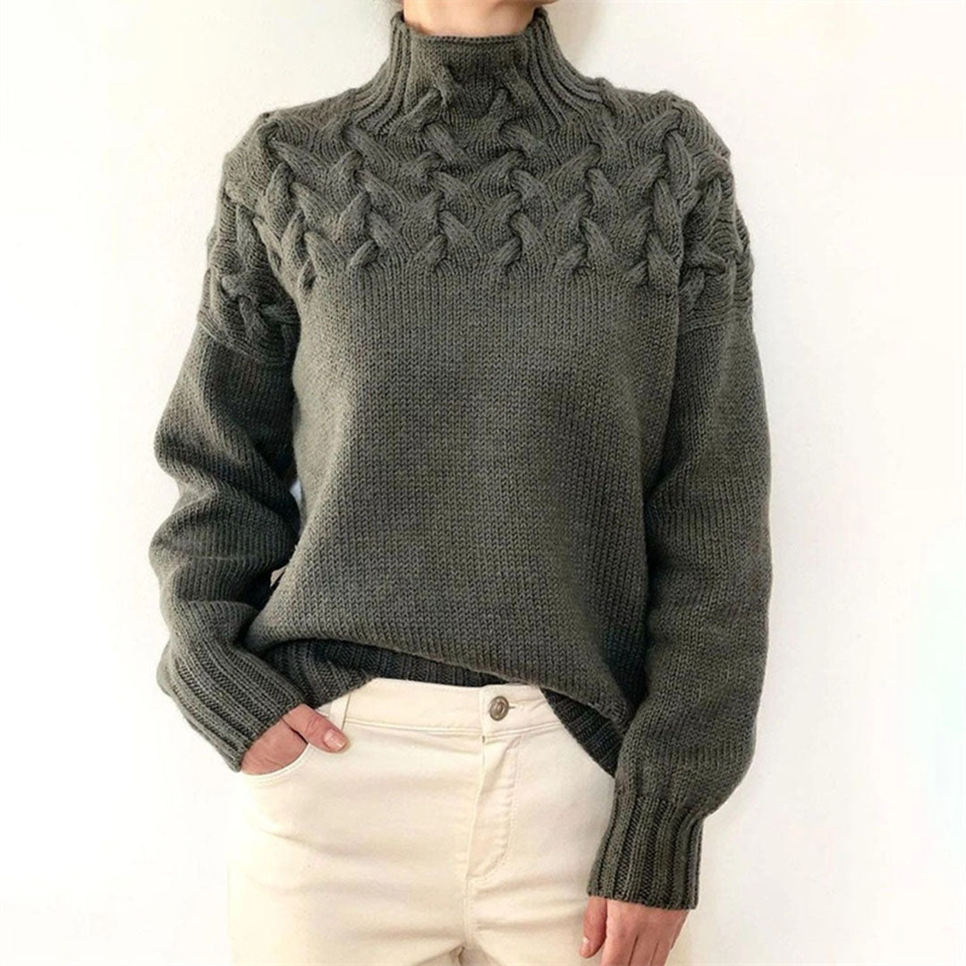 Suéter femenino de cuello alto, tejido suave y cálido, perfecto para un look de moda invernal.