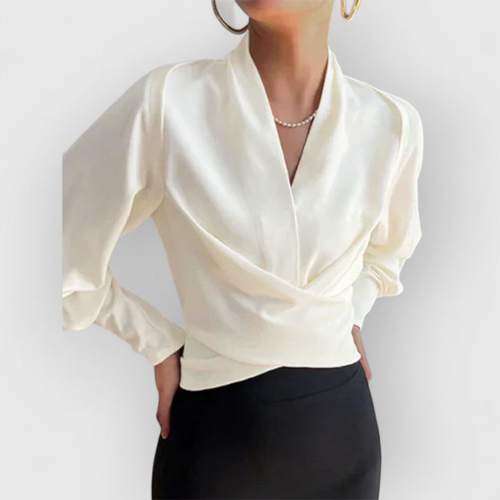 Camisa versátil de mujer con mangas abullonadas, ideal para un estilo casual o formal de oficina.