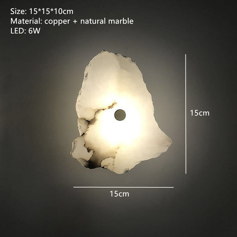 Mármol natural y acentos cobre en este aplique LED de pared Aurora elegante, realzando la decoración.
