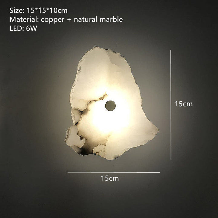 Mármol natural y acentos cobre en este aplique LED de pared Aurora elegante, realzando la decoración.