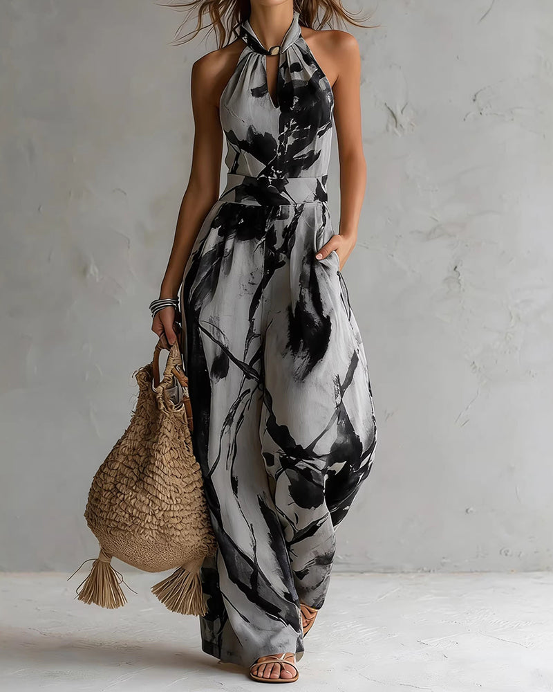 Atuendo casual chic: mono de verano con diseño acuarela único, corte halter y pernera ancha fluida.