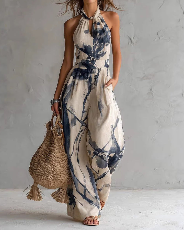 Mono mujer halter con estampado acuarela vibrante y pierna ancha. Estilo elegante y cómodo para verano.