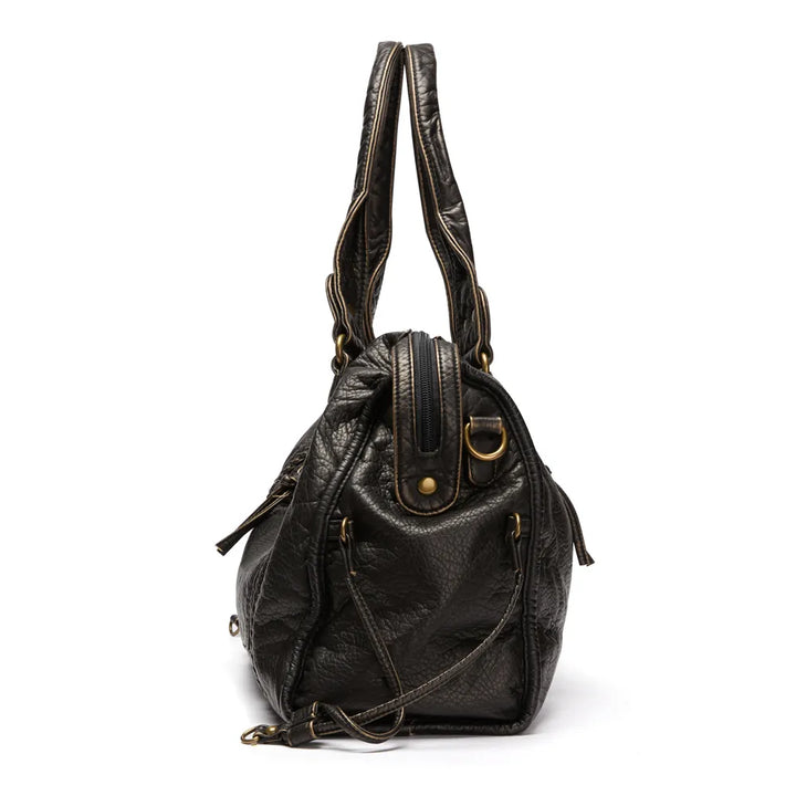 Bolso negro de moda casual, espacioso y funcional para mujer. Llévalo como bolso de mano o bandolera.