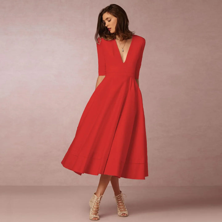 Vestido midi fluido para mujer, con escote en V y mangas al codo. Elegante para cualquier evento.