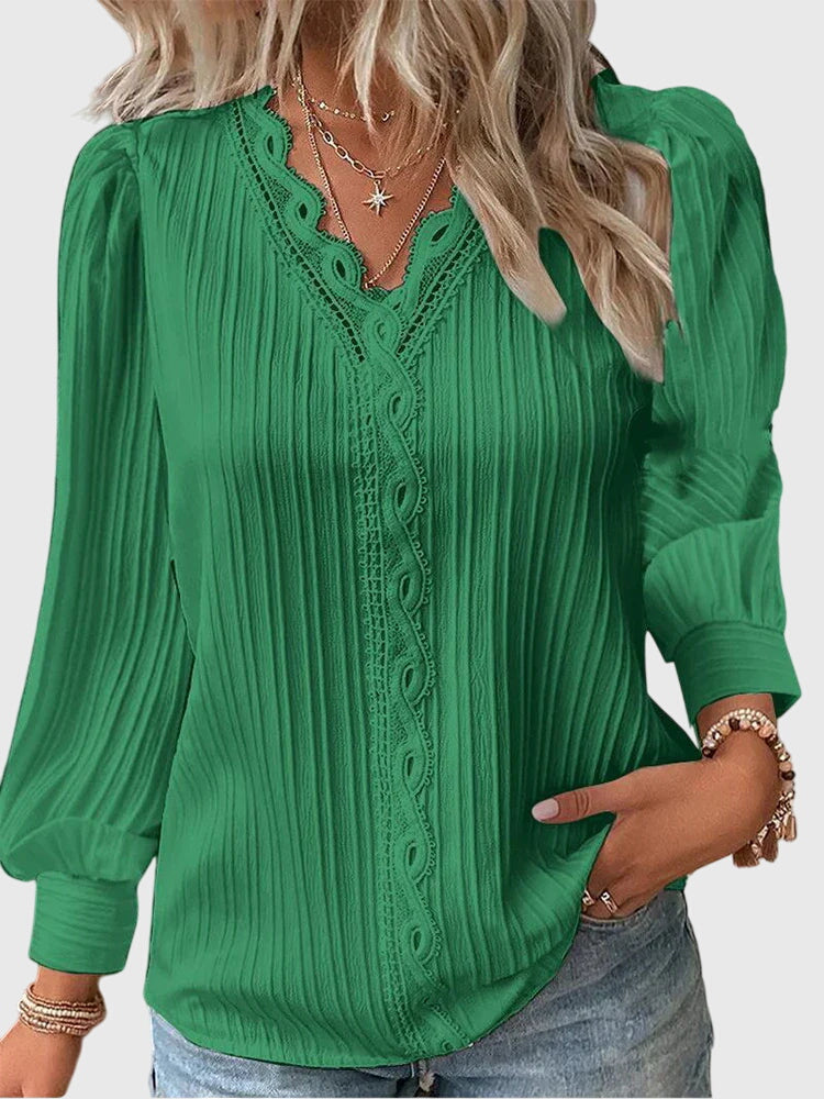 Blusa casual de mujer con cuello V y encaje. Diseño versátil de manga larga, ideal para cualquier ocasión y estilo.